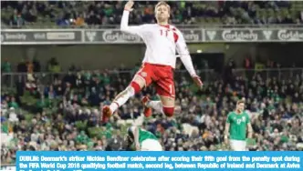  ??  ?? DUBLIN: Denmark’s striker Nicklas Bendtner celebrates after scoring their fifth goal from the penalty spot during the FIFA World Cup 2018 qualifying football match, second leg, between Republic of Ireland and Denmark at Aviva Stadium in Dublin. — AFP