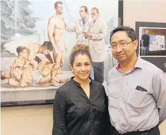  ?? DANIEL HALLEN ?? Dr. Lizbeth Hernandez-Ronquillo and Dr. Jose Tellez-Zenteno, of the University of Saskatchew­an, stand in front of Mexican artist Eduardo Urbano Merino’s painting Epilepsy, leaving behind the nightmare.