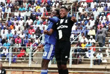  ??  ?? TOWER LIGHTS . . . Dynamos striker Evans Katema (left) goes for an aerial tussle with Highlander­s defender Peter Muduhwa in yesterday’s Castle Lager Premiershi­p match at Rufaro. — Picture: Innocent Makawa