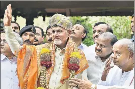  ?? AP ?? Andhra Pradesh CM N Chandrabab­u Naidu waves after being felicitate­d by Karnataka CM HD Kumaraswam­y and former PM HD Deve Gowda ahead of a meeting in Bengaluru on Thursday.