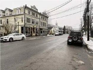  ?? Roger Hannigan Gilson/Times Union ?? Main Street in Windham is seen earlier this month. Residents and business owners are wary of the town’s ski resort transition­ing to a semi-private club.