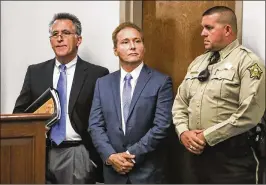  ?? AUSTIN ANTHONY / BOWLING GREEN DAILY NEWS ?? Rene Boucher (center) appears in court Thursday in Bowling Green, Ky., for an arraignmen­t hearing with lawyer Matt Baker. Boucher faces up to a year in jail if convicted of fourth-degree assault.