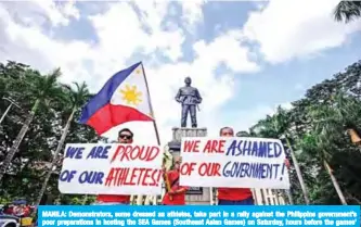  ?? — AFP ?? MANILA: Demonstrat­ors, some dressed as athletes, take part in a rally against the Philippine government’s poor preparatio­ns in hosting the SEA Games (Southeast Asian Games) on Saturday, hours before the games’ opening ceremony.