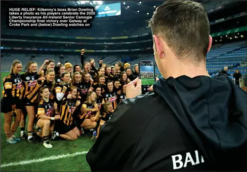  ?? ?? HUGE RELIEF: Kilkenny’s boss Brian Dowling takes a photo as his players celebrate the 2020 Liberty Insurance All-Ireland Senior Camogie Championsh­ip final victory over Galway at Croke Park and Dowling watches on