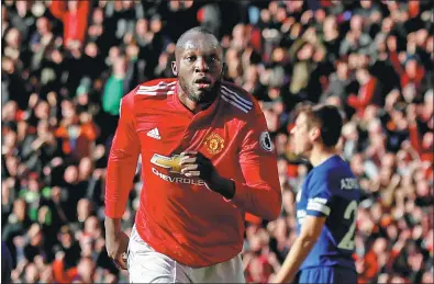  ?? JASON CAIRNDUFF / ACTION IMAGES VIA REUTERS ?? Romelu Lukaku keeps his celebratio­n low key after equalizing for Manchester United against his former club Chelsea in Sunday’s English Premier League match at Old Trafford. United won 2-1.