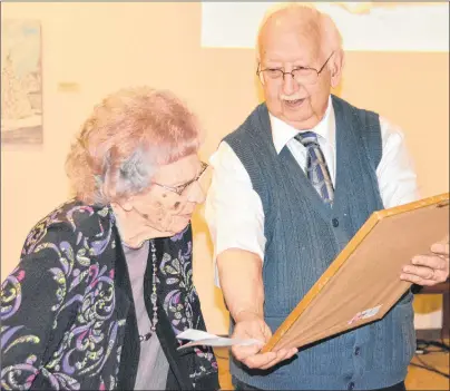  ?? TAYA GAUDET/JOURNAL PIONEER ?? Mildred Savidant, left, receives the Gerard Gallant Award from Gerard Gallant during the Summerside and Area Historical Society annual meeting at Eptek Centre in Summerside.