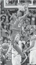  ?? Brett Coomer / Houston Chronicle ?? Rockets center Clint Capela gives LeBron James a close look at his bread-and-butter play, scoring on a dunk against the Cavaliers on Nov. 9.