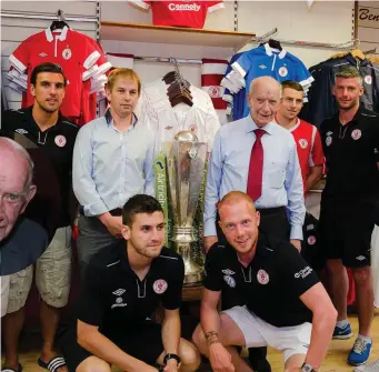  ??  ?? On the shop floor at the family store, Lavin’s of O’Connell Street, Ballymote. Pictured also is Tommy’s son, John with members of Sligo Rovers during a visit to the shop.