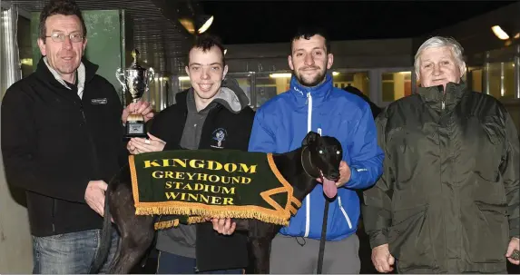  ?? Photo by www.deniswalsh­photograph­y.com ?? KGS manager Declan Dowling presents the winner’s trophy to Diarmuid Lynch on behalf of the winning owners after Ballymac Gina won the Kingdom Stadium Novice Sprint Stakes Final at the Kingdom Dtadium on Friday night. Included are Stephen Reidy and Micky Reidy.