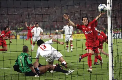  ??  ?? In this Wednesday, May 25, 2005 file photo, Liverpool's Luis Garcia, right, celebrates after his teammate Xabi Alonso, behind him at right, scored his team's 3rd goal, during the Champions League Final between AC Milan and Liverpool at the Ataturk...