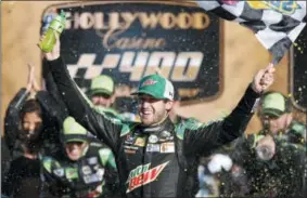  ?? COLIN E. BRALEY — THE ASSOCIATED PRESS ?? Chase Elliott celebrates winning a NASCAR Cup Series auto race at Kansas Speedway in Kansas City, Kan., Sunday.