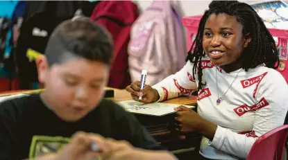  ??  ?? Keiana Williams, 9, works on a math problem. Serenity’s focus on positivity and fellowship has earned it a ranking of 126 out of 905 local schools and raised its overall grade from a D in 2016 to an A-.