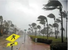  ?? Reuters-Yonhap ?? Heavy wind batters Ocean Drive in South Beach as Hurricane Irma arrives at Miami Beach, Fla., Sunday.
