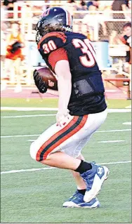  ?? Westside Eagle Observer/ANNETTE BEARD ?? Gravette junior Kyler Austin carries the ball during play against Pea Ridge on Aug. 26.