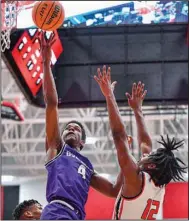  ?? (NWA Democrat-Gazette/Hank Layton) ?? Fayettevil­le’s Ornette Gaines (left) attempts a layup as Fort Smith Northside’s Dae’Marion Savoy defends during Friday night’s 6A-West Conference game at Northside Arena in Fort Smith.