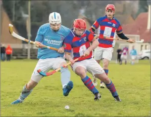  ?? Photograph: Neil Paterson. ?? Liam Symonds, Caberfeidh, and Darren Hanlan, Kingussie, in action on Saturday. The sides were competing in the annual match for the William MacPherson Plate, in memory of Bill MacPherson.