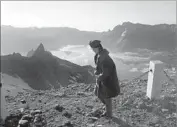  ?? David Guttenfeld­er Associated Press ?? A NORTH KOREAN woman walks on the peak of Mt. Paektu in Ryanggang province in June 2014.