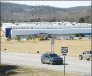  ?? (NWA Democrat-Gazette/David Gottschalk) ?? Traffic passes Monday by the former Standard Register Co. building at 3655 S. School Ave. in Fayettevil­le. Plans are in the works to turn the building into a 99,000-square-foot warehouse with a nearly 40,000-square-foot office and showroom. Go to nwaonline.com/210223Dail­y/ and nwadg.com/photos for a photo gallery.