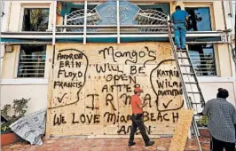  ?? CAROLYN COLE/LOS ANGELES TIMES ?? A Miami Beach property’s graffiti tallies some of the storms Florida has felt or witnessed.