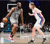  ?? Corey Sipkin / Associated Press ?? Brooklyn’s James Harden, left, drives on Detroit’s Kelly Olynyk in the second half of the Nets’ 117-91 home win Sunday. Harden had 18 points, 10 rebounds and 12 assists.