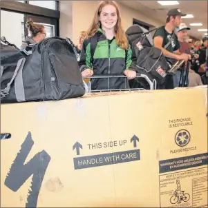  ?? JIM DAY/THE GUARDIAN ?? Marilyn Sheen, 16, of Stanley Bridge was not travelling light Thursday morning as she wheeled her bike into the Charlottet­own Airport. Sheen is competing in mountain biking at the 2017 Canada Games.