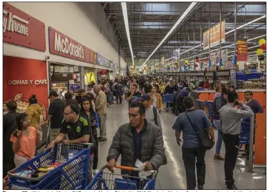  ?? (Bloomberg News) ?? Shoppers fill a Walmart de Mexico SAB store in Mexico City in this 2019 file photo. Mexico offers huge growth potential for electronic payments providers, according to the digital business research firm bnamericas.