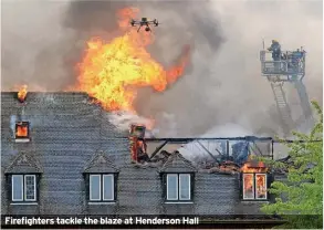  ?? ?? Firefighte­rs tackle the blaze at Henderson Hall