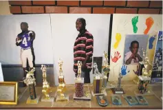  ?? MONICA ALMEIDA/THE NEW YORK TIMES ?? A memorial to Jamiel Shaw Jr., who was shot and killed by a gang member who had entered the country illegally, in his family living room in Los Angeles. ‘He’s speaking for the dead,’ said Jamiel Shaw Sr., of Trump. ‘He’s speaking for my son.’