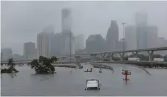  ?? (Richard Carson/Reuters) ?? JEWISH RESIDENTS of Houston will receive monetary aid from Israel to help repair the costly August damages of Hurricane Harvey.