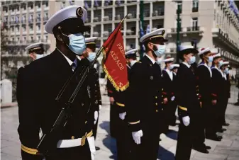  ?? Thanassis Stavrakis / Associated Press ?? Members of the French navy attend a parade commemorat­ing Greek independen­ce day in Athens. The event was open to spectators with the easing of coronaviru­s restrictio­ns.
