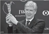  ??  ?? Arsene Wenger poses after winning the Lifetime Achievemen­t Award at the Laureus World Sports Awards in Monaco on February 18, 2019. — Reuters