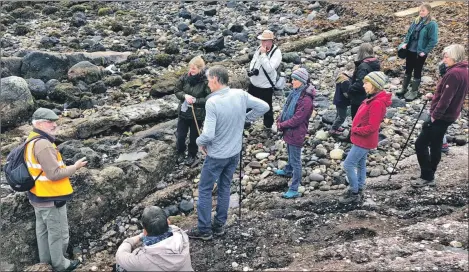  ??  ?? Enjoying the sun and a geology walk on Corrie shore.