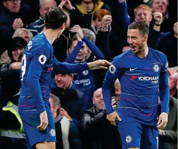  ??  ?? Two easy: Alvaro Morata of Chelsea celebrates scoring his second goal with Eden Hazard to make it 2-1