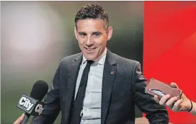  ?? CHRISTOPHE­R KATSAROV THE CANADIAN PRESS ?? National team head coach John Herdman discusses the successful joint North American bid by Canada, the U.S. and Mexico to host the 2026 World Cup at a news conference.