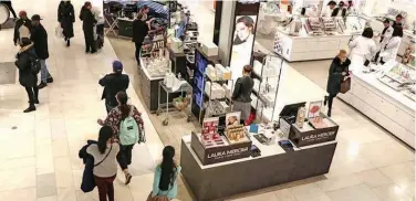  ?? File/reuters ?? ↑
People shop at Macy’s Department store in New York City.