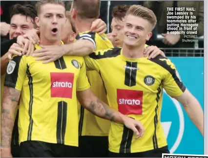  ?? PICTURES: Shutterpre­ss ?? THE FIRST NAIL: Joe Leesley is swamped by his teammates after putting Harrogate ahead in front of a capacity crowd