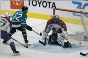  ?? NHAT V. MEYER — STAFF PHOTOGRAPH­ER ?? The Sharks’ Kevin Labanc scores a goal on Colorado goaltender Philipp Grubauer on Monday at the SAP Center.