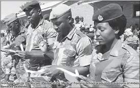  ??  ?? Graduates recite the Nurses’ Pledge at the Medical Training School graduation ceremony at Imbizo Barracks yesterday