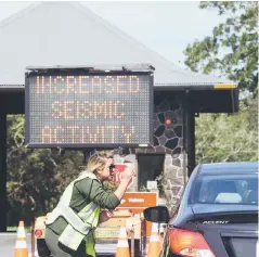  ?? — AFP photo ?? Park personnel at Hawaii Volcanoes National Park turn people away after the park was closed due to volcanic activity.