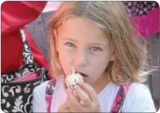  ?? Photograph­s by Cary Beavers ?? Hannah Davenport, 6, of Bristol, enjoys a cake pop.