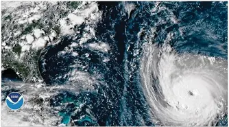  ??  ?? Hurricane Florence churns through the Atlantic Ocean toward the U.S. East Coast on Tuesday. Florence is expected to make landfall by late Thursday to near Category 5 strength along the Virginia, North Carolina and South Carolina coastline.