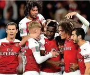  ?? AFP ?? Mobbed: Danny Welbeck is surrounded by team-mates after opening the scoring