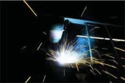  ?? SEAN KILPATRICK — THE CANADIAN PRESS VIA AP ?? A welder fabricates a steel structure at an iron works facility in Ottawa, Ontario, Monday. President Donald Trump insisted Monday that he’s “not backing down” on his plan to impose stiff tariffs on imported steel and aluminum. Trump said that Canada...