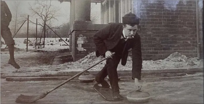  ??  ?? A curler sends his stone slip, sliding away as a player from Partick Curling Club enjoys a game in 1904. The club was playing at Victoria Park at this time, having been gifted a clubhouse and adjoining rinks