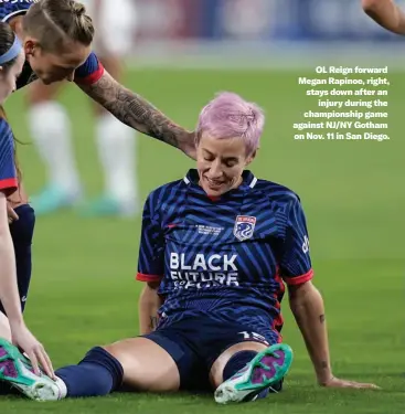  ?? ?? OL Reign forward Megan Rapinoe, right, stays down after an injury during the championsh­ip game against NJ/NY Gotham on Nov. 11 in San Diego.