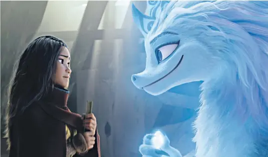  ??  ?? Disney successful­ly updates its traditiona­l princess with some moves that would make Rapunzel’s hair stand on end, as Raya (Kelly Marie Tran) seeks the help of a dragon to bring harmony to her country