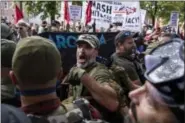  ?? CALLA KESSLER / THE WASHINGTON POST ?? A protester shouts during a Unite the Right rally on Saturday in Charlottes­ville, Va.