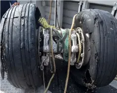  ?? — AFP photo ?? Wheels from the ill-fated jet are seen after they were recovered from the sea, north of Karawang.