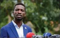  ?? (AP/Nicholas Bamulanzek­i) ?? Uganda presidenti­al candidate Bobi Wine told reporters Friday at his home in Magere that whatever was being declared about the vote count is “a total sham.”