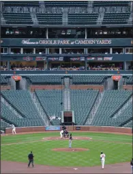  ?? (AP file photo) ?? The Baltimore Orioles and the Chicago White Sox play a game without fans at Camden Yards in Baltimore on April 29, 2015. The game was closed to fans because of security concerns after a state of emergency was issued amid ongoing protests and civil unrest after a 25-year-old black man died while in police custody. It is the only major-league game played with no fans in attendance.